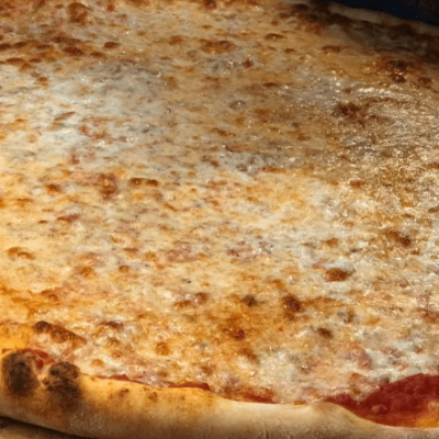 close up of whole cheese pizza
