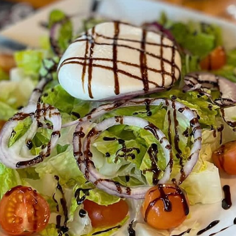 close up of Italian style salad with balsamic dressing