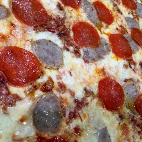 close up of meat lovers pizza
