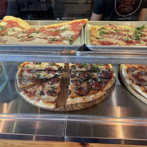 pizzas on display in Sal's Pizza Bar Dr. Phillips