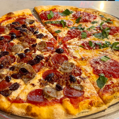 fresh pizza on dining table in Sal's Orlando